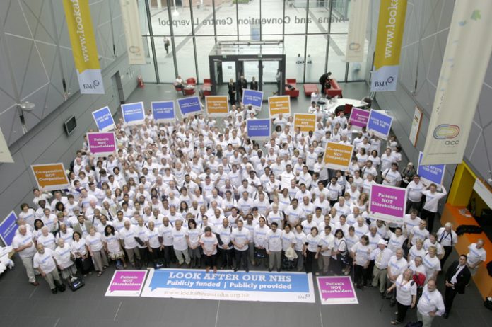 BMA delegates show their opposition en masse to NHS privatisation at their Annual Representative Meeting in Liverpool yesterday