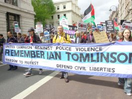 Banner commemorating Ian Tomlinson who died after being assaulted by police in the City of London on April 1st as he was trying to get home