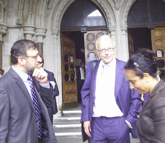 MAZIN YOUNIS of the Iraqi League (left) with PHIL SHINER of Public Interest Lawyers outside the High Court yesterday