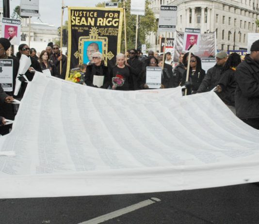 The large banner of the United Families and Friends campaign against deaths in police custody with the names of over 2,500 victims