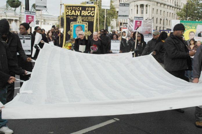 The large banner of the United Families and Friends campaign against deaths in police custody with the names of over 2,500 victims