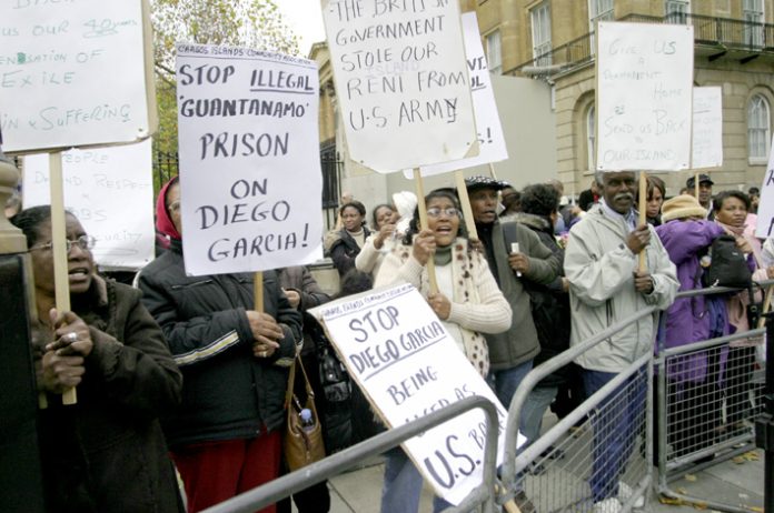 Chagos Islanders demonstrate outside Downing Street in November 2007 demanding to return to their home in Diego Garcia