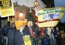 The North East London Council of Action demonstrating outside the clocktower entrance to Chase Farm Hospital. Now NHS hospitals face private takeover