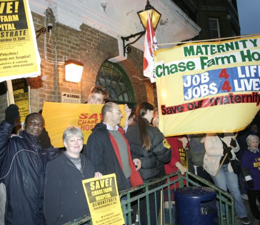 The North East London Council of Action demonstrating outside the clocktower entrance to Chase Farm Hospital. Now NHS hospitals face private takeover