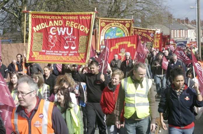 Postal workers marching in Wolverhampton against privatisation. Stoke postal workers are on strike against plans for them to travel to work in Wolverhampton – a 75 mile round trip