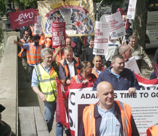 Postal workers marched on Royal Mail head office in July demanding the resignation of Royal Mail chief executive  Adam Crozier