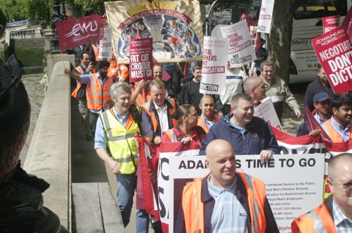 Postal workers marched on Royal Mail head office in July demanding the resignation of Royal Mail chief executive  Adam Crozier