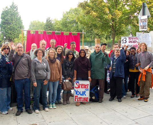 Determined striking lecturers on their picket line outside Tower Hamlets College yesterday
