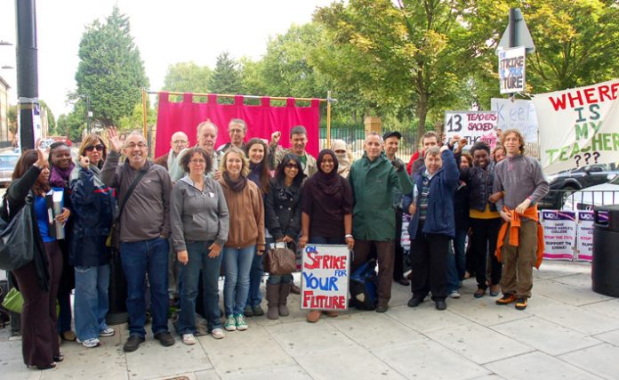 Determined striking lecturers on their picket line outside Tower Hamlets College yesterday