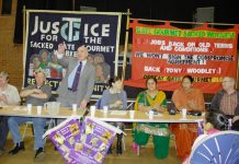 STEPHEN POUND MP (centre) speaking at yesterday’s fourth anniversary rally, with sacked Gate Gourmet workers also on the platform