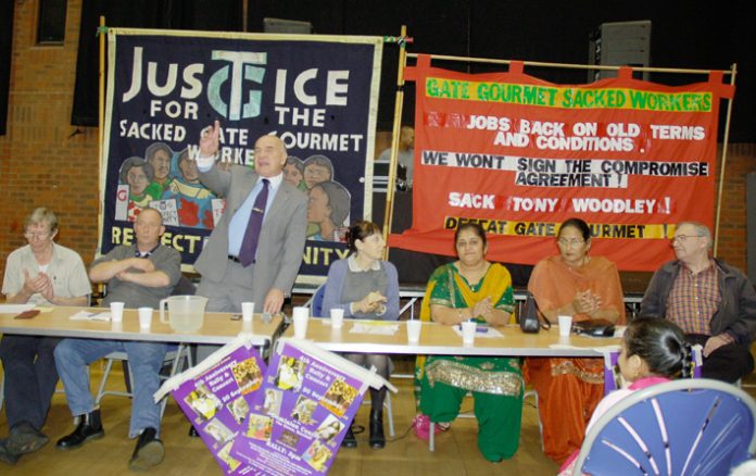 STEPHEN POUND MP (centre) speaking at yesterday’s fourth anniversary rally, with sacked Gate Gourmet workers also on the platform