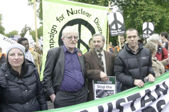 Lance Corporal JOE GLENTON (far right) and his wife CLARE (left) with PETER BRIERLEY (second from left) whose son Shaun was killed in Iraq, leading off the October 24th march in London against the war on Afghanistan