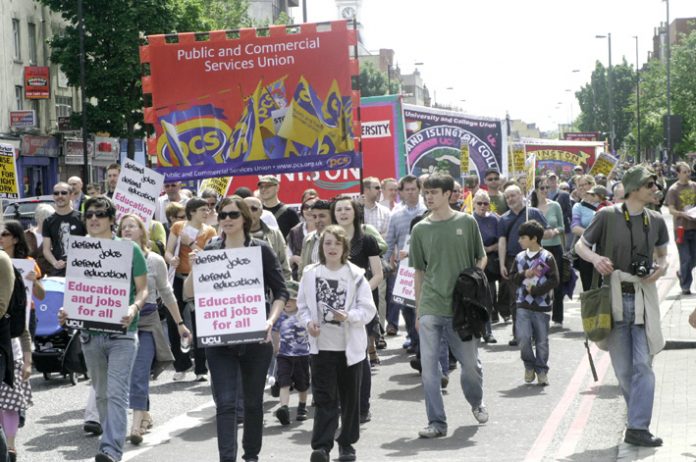 PCS banner on a march in support of London Metropolitan University workers fighting against job cuts