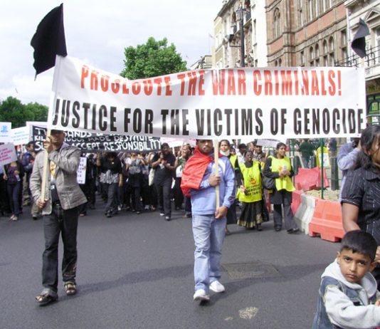 Tamils marching in London on June 20 demanding Sri Lankans responsible for genocide be prosecuted for war crimes