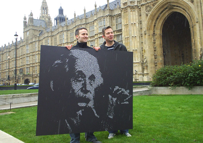 Two UCU members hold up a picture of Einstein outside the House of Commons on Wednesday Einstein who said about research ‘If we knew what it was what we were doing, it would not be called research, would it?’