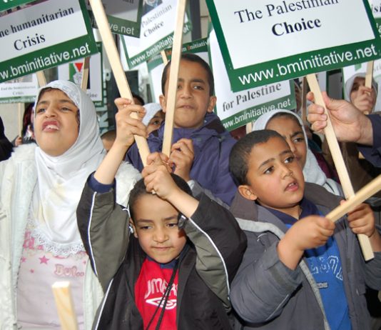 Children at a rally in Trafalgar Square in support of the Palestinian struggle – in Gaza last week children marched to mark the anniversary of Israel’s murderous assault