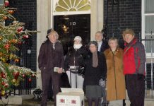 Military families deliver an anti-Afghan war petition to 10 Downing Street just before Christmas