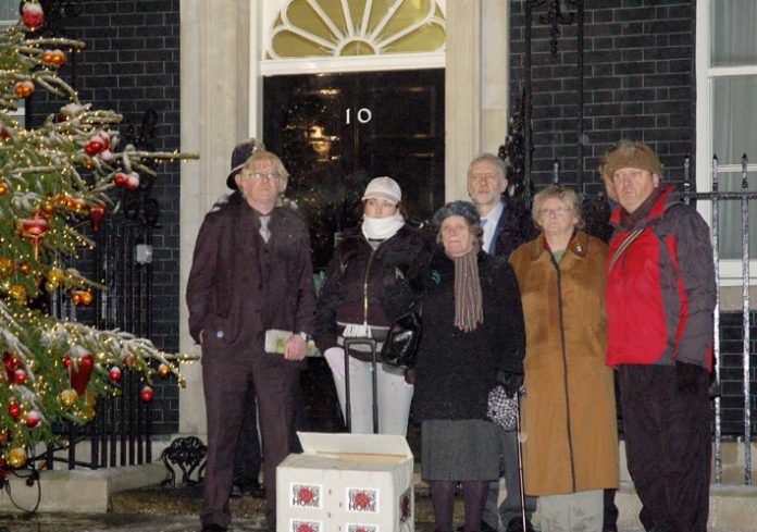 Military families deliver an anti-Afghan war petition to 10 Downing Street just before Christmas