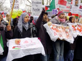 Marchers in London on January 10 last year depicting the slaughter of Palestinian children by the Israeli army last January