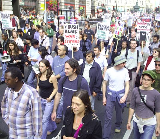 Marchers in London in September 2005 against the war on Iraq condemn Bush and Blair as war criminals