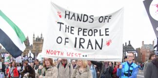 Demonstrators in London defending the Iranian people against attempts by the US and UK to attack them
