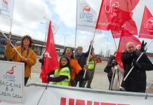 Striking BA cabin crew with  their families on the Heathrow picket line on Tuesday