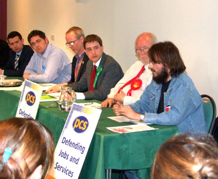 Workers Revolutionary Party Norwich Central candidate GABRIEL POLLEY speaks out to the discomfort of leading Blairite CHARLES CLARKE (second from right)