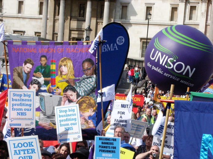 National Union of Teachers banner and Unison balloon at the Trafalgar Square rally to ‘Defend the Welfare State’ on April 10
