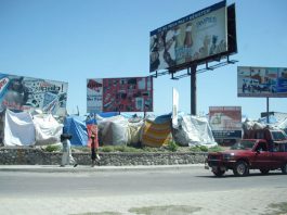 Tent shelters beside a road in Haiti