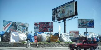Tent shelters beside a road in Haiti