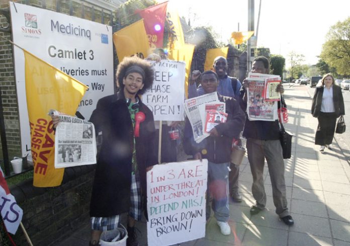 PAUL LEPPER (left) WRP canditate for Streatham joined the North East London Council of Action picket to stop the closure of Chase Farm Hospital