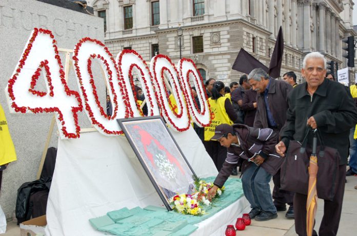 Generations of Tamils lay flowers in Parliament Square to commemorate the 40,000 civilians killed during the final stages of the Sri Lankan army war against the Tamil Tigers