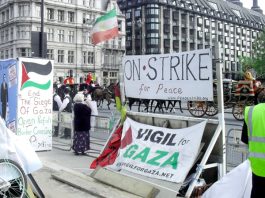 The Queen’s carriage being driiven past the peace camp for the state opening of parliament