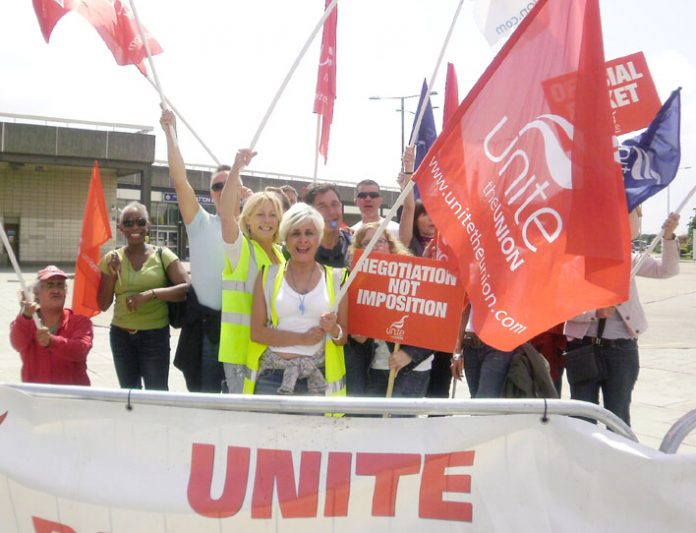 Confident striking BA cabin crew on the picket line at Heathrow yesterday