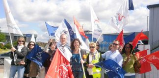 Determined BA cabin crew on the picket line at Heathrow yesterday