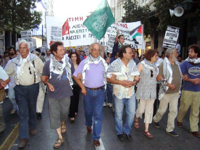Freedom Flotilla volunteers back from a Zionist prison leading the Athens march