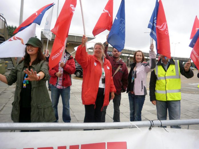 Striking BA cabin crew at Heathrow yesterday determined to win their struggle