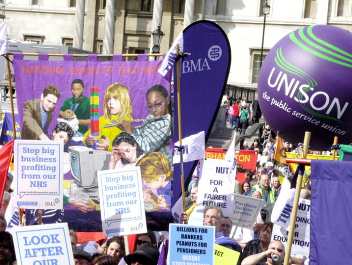Trade unionists rally in Trafalgar Square to defend the welfare state on April 14