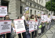 PCS members outside the Treasury yesterday highlight the £120 billion in outstanding tax debts owed by big business