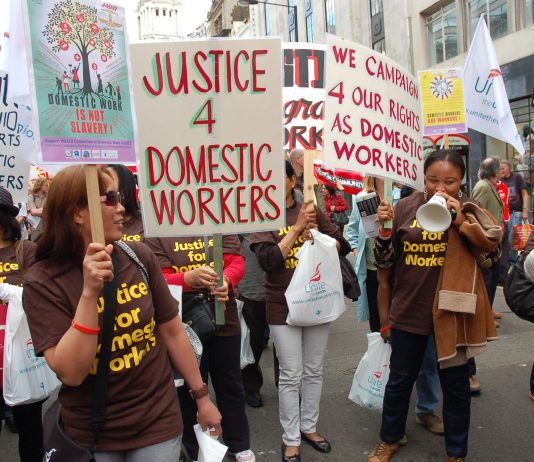 Migrant workers in the front of the May Day march in London – defending their jobs and wages