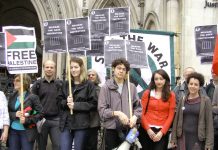 Demonstrators outside the High Court yesterday demanding the immediate release of youth jailed for demonstrating against Israel’s attacks on Gaza