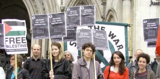 Demonstrators outside the High Court yesterday demanding the immediate release of youth jailed for demonstrating against Israel’s attacks on Gaza