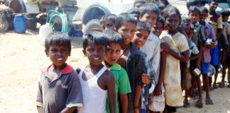 Hungry Tamil children queue for meagre rations