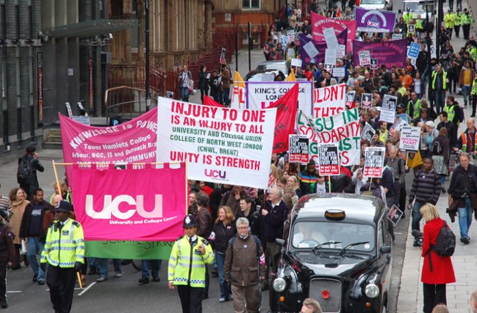 Lecturers and students marching from Kings College in central London last May against job cuts and tuition fees