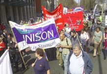 Trade union banners on the march to Defend the Welfare State last April in London