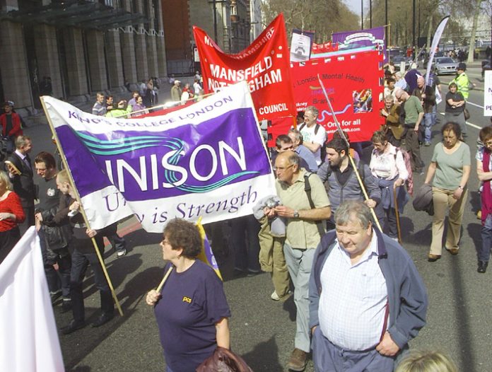 Trade union banners on the march to Defend the Welfare State last April in London