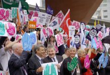 UNISON General Secretary DAVE PRENTIS (second from left) alongside Unite co-leaders SIMPSON and WOODLEY backed by delegates. The three leaders of the two biggest unions in the country are refusing to call for bringing down the coalition government