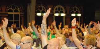 Congress delegates voting for the main resolution on Monday