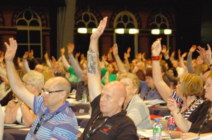 Congress delegates voting for the main resolution on Monday