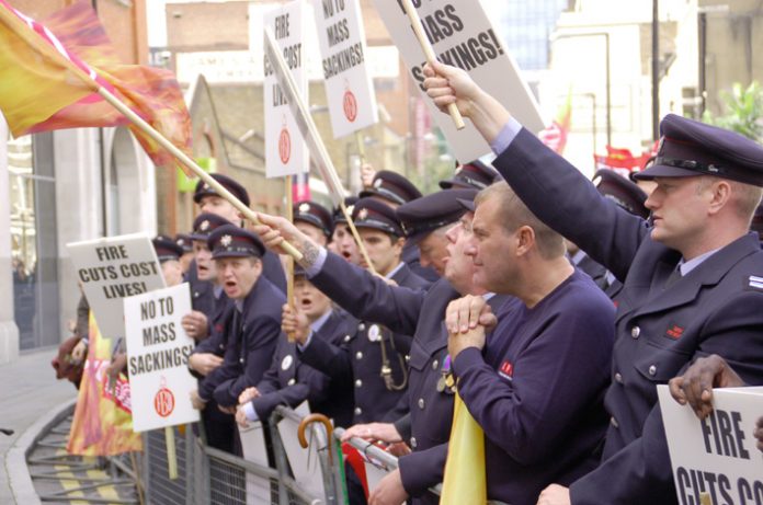 London firefighters rallying yesterday outside the London Fire Brigade Headquarters – they are absolutely determined to defend their hard won conditions